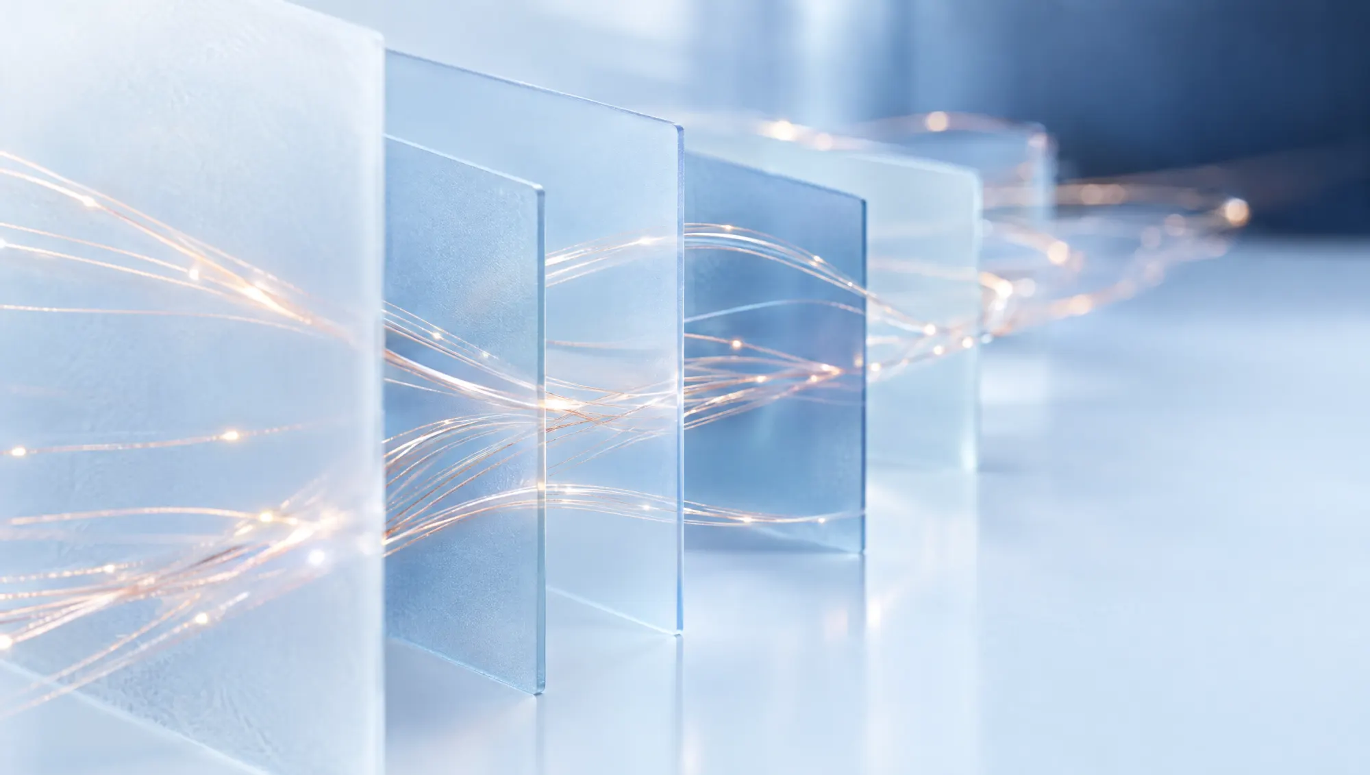 Copper light filaments weaving through frosted blue glass sheets.